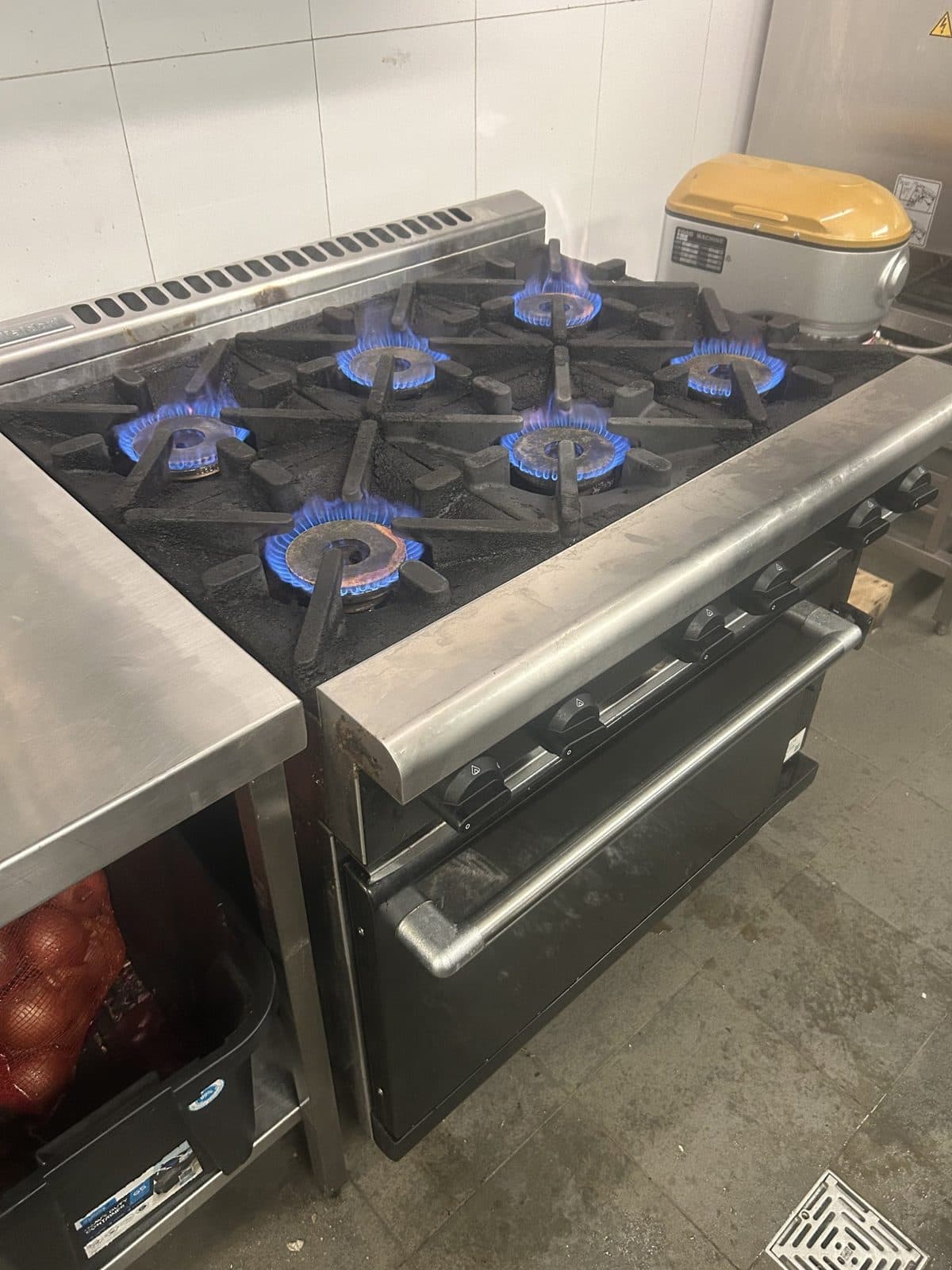 Commercial gas cooktop with every burner lit